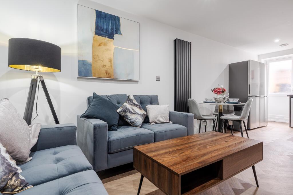 A modern and inviting living room featuring a c...