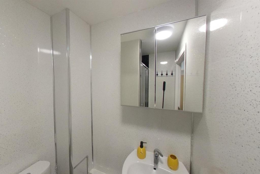 Bright, modern bathroom with a clean white sink...