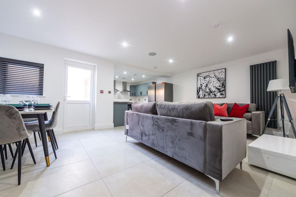 A modern and spacious living room featuring a l...