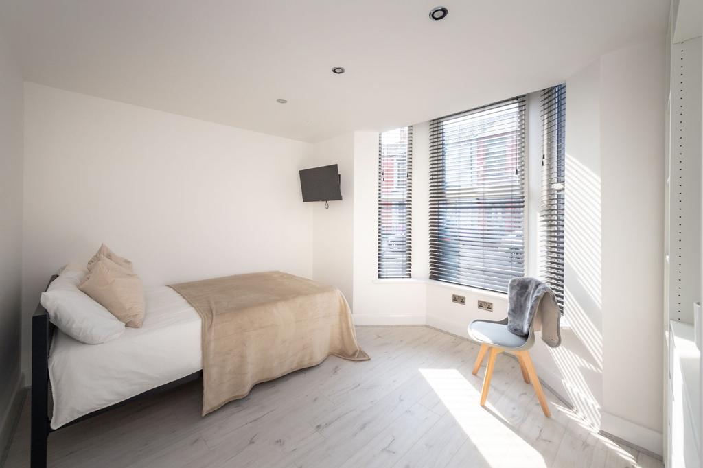 Bright and airy double bedroom featuring natura...