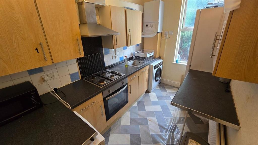 Long galley kitchen with modern appliances, amp...
