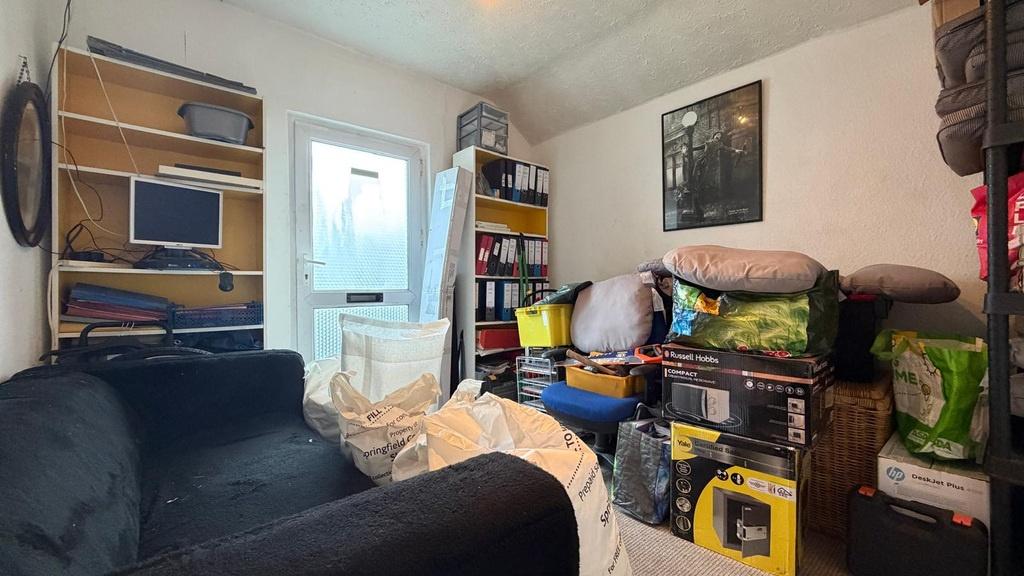 Cosy living room with a comfortable sofa, shelv...