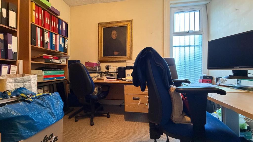 Well-equipped shared workspace with two desks, ...