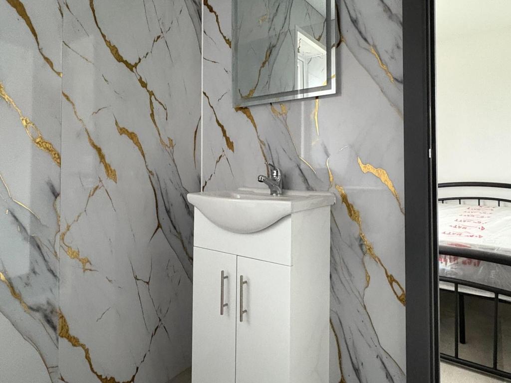 Bright, modern bathroom corner with a stylish w...
