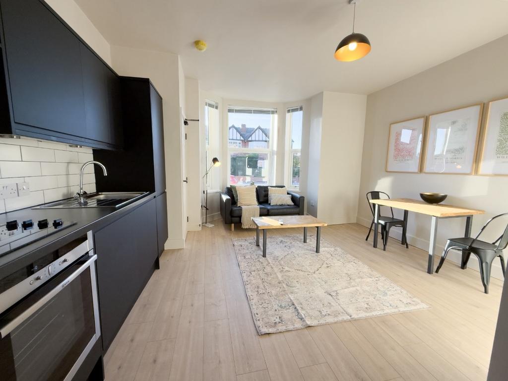 Bright, modern open-plan living area with a fit...