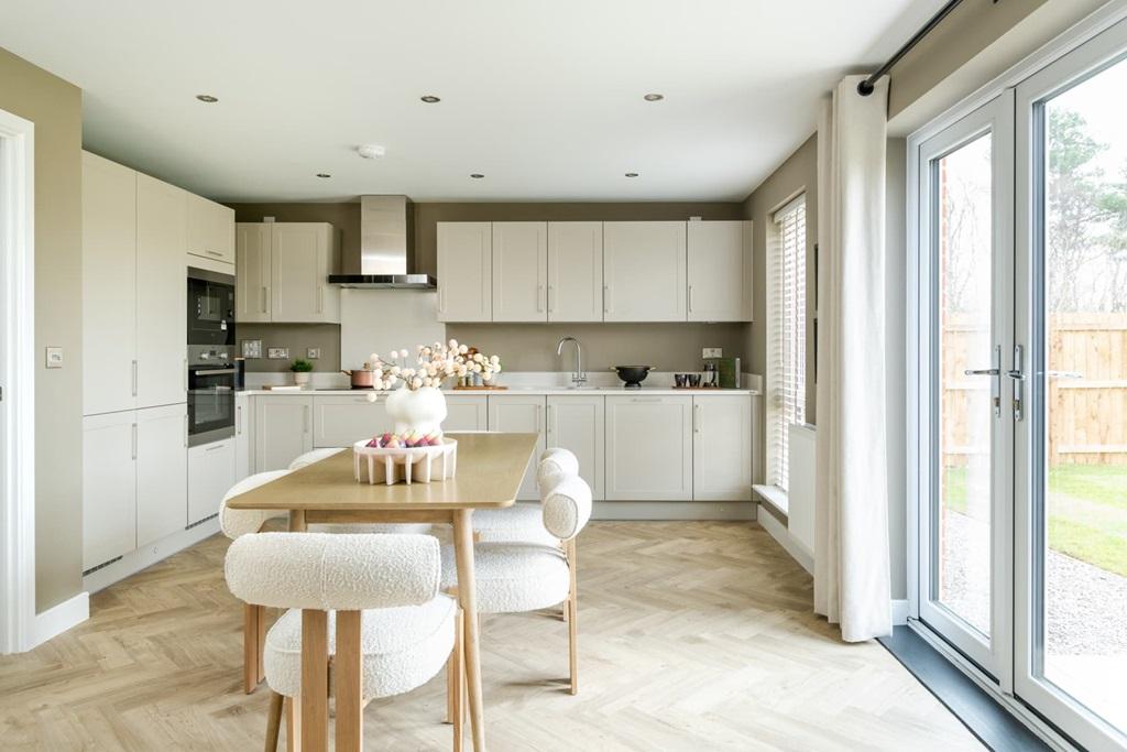 A modern kitchen and dining area with ample...