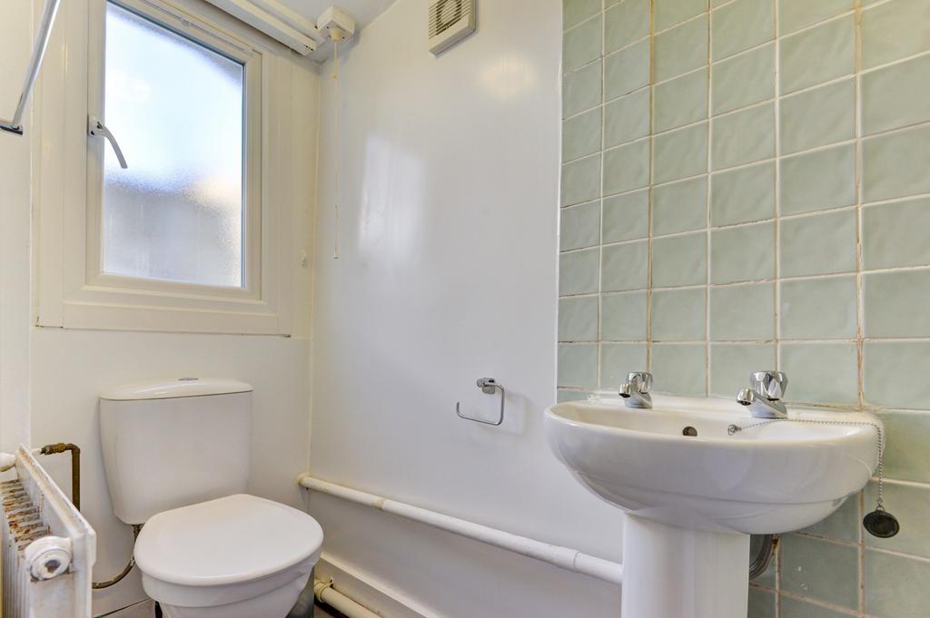 A clean and functional bathroom featuring a toi...