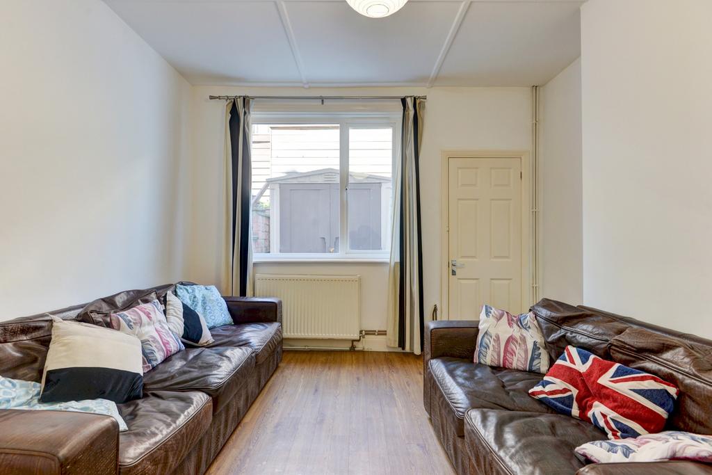 A bright and cozy living room featuring two com...