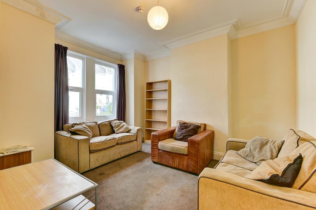 Bright and welcoming living room featuring mult...