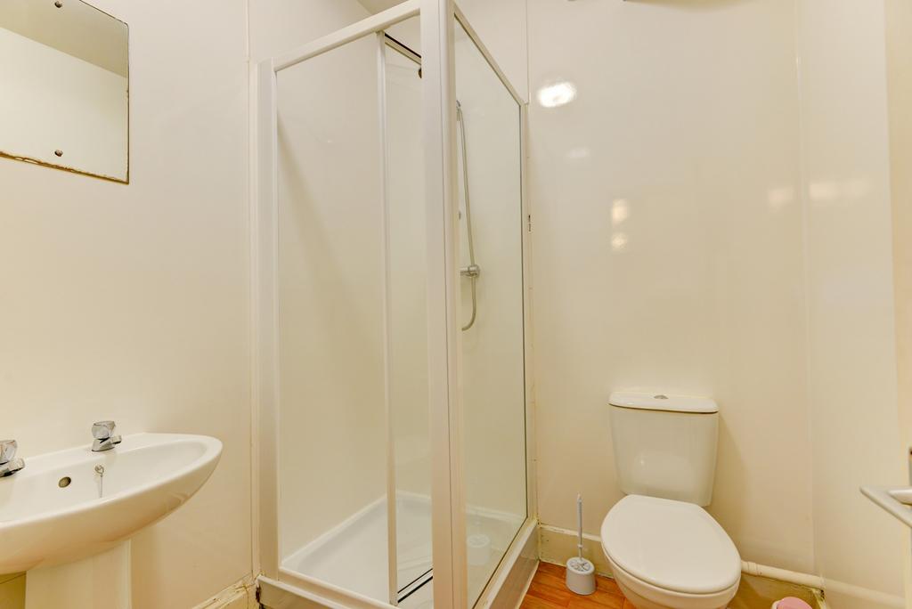 A clean, well-maintained bathroom featuring a s...