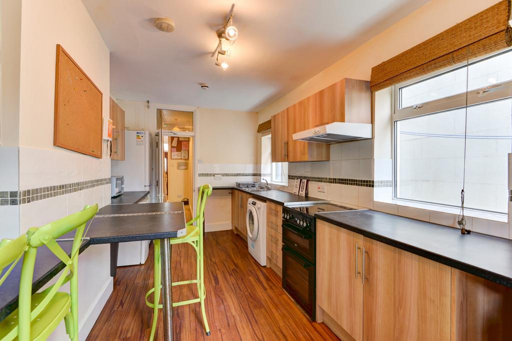 Bright and modern kitchen with ample natural li...