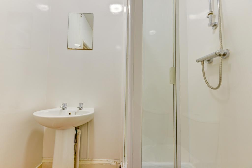 A clean and well-maintained bathroom featuring ...