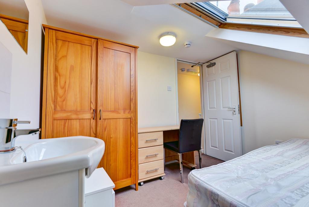 A compact and tidy bathroom with good natural l...