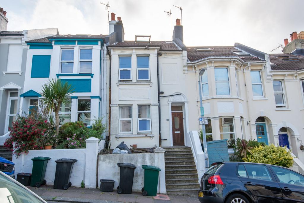 A charming front view of a traditional terraced...