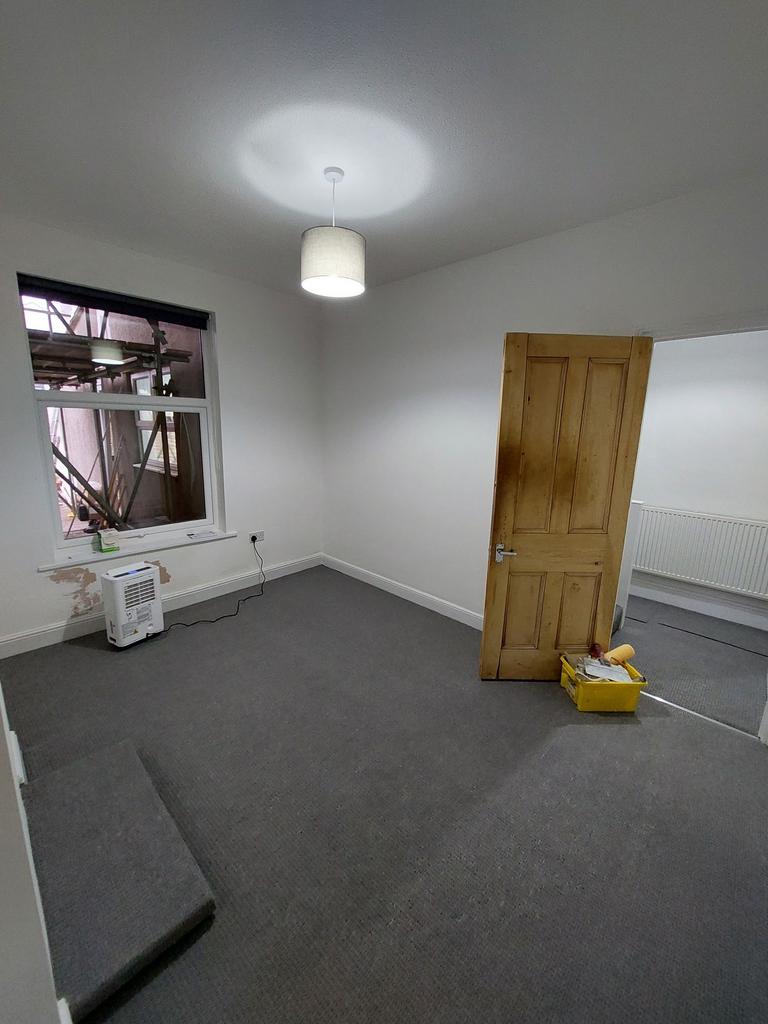 Bright, recently refreshed bedroom with neutral...
