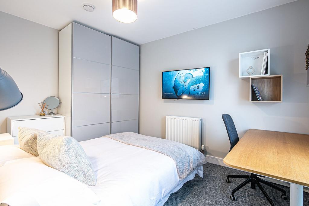 Bright and modern bedroom featuring a cozy bed ...
