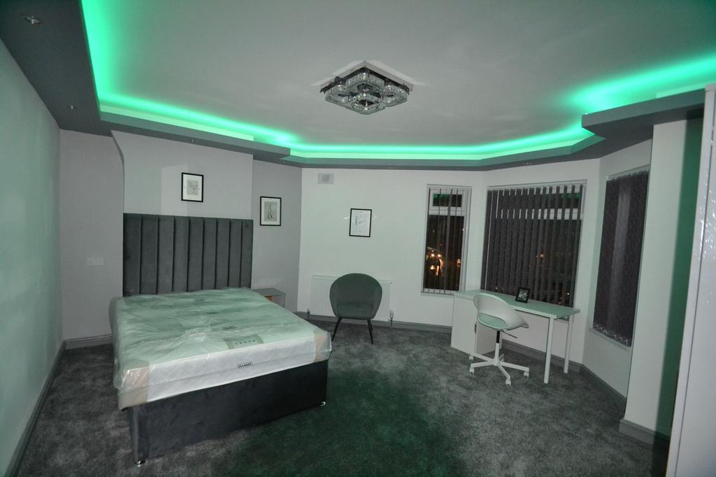 Spacious, recently updated bedroom with a plush...