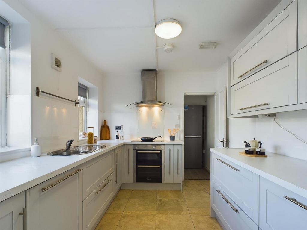 A modern and spacious kitchen with ample natura...