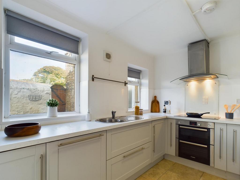 A bright and modern kitchen with ample counter ...