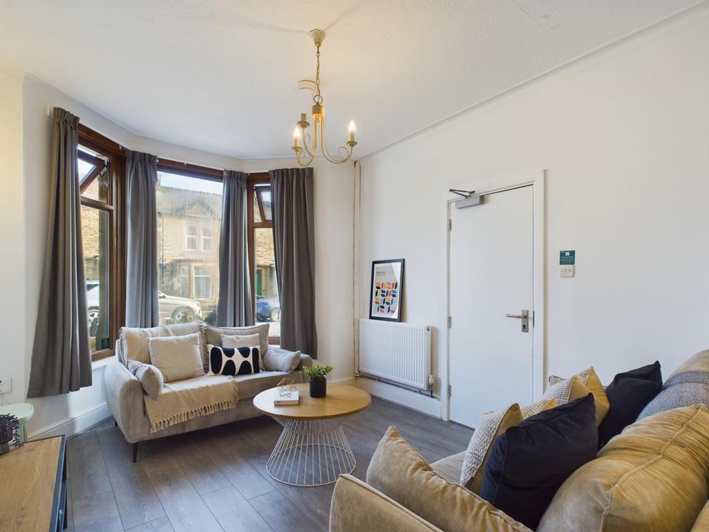 A bright and inviting large modern living room,...