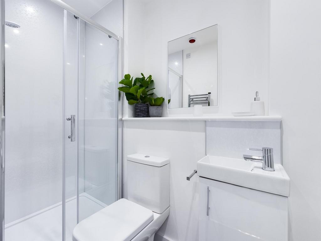 A bright and modern bathroom featuring a sleek ...
