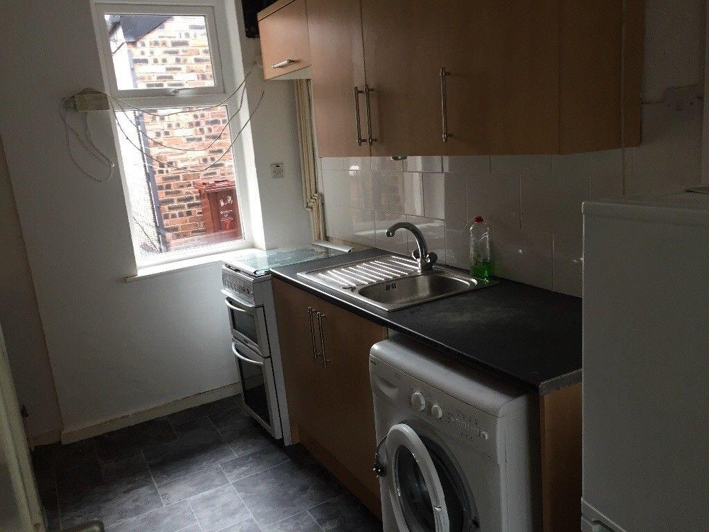 Compact, practical kitchen with fitted cabinets...