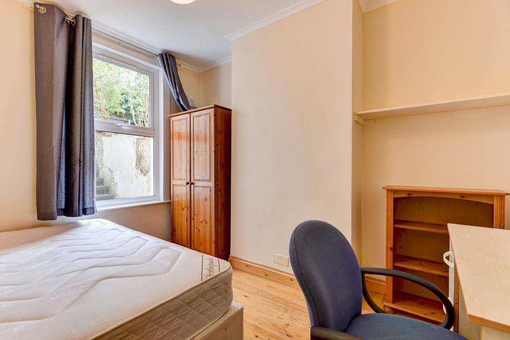 Bright, well-presented bedroom with a large win...