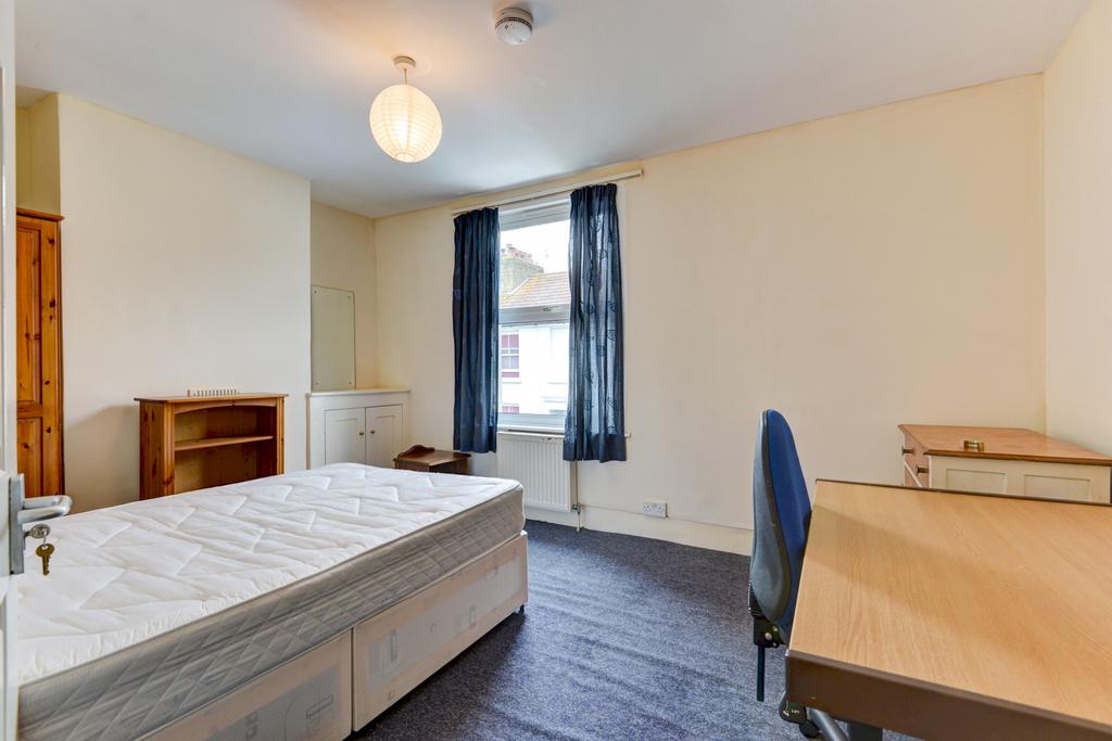 Bright, neatly presented bedroom with a double ...