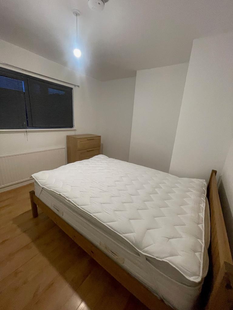 A neat and well-maintained bedroom featuring a ...