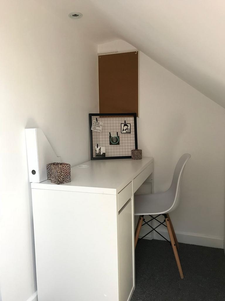 Bright, minimalist study corner with a clean wh...