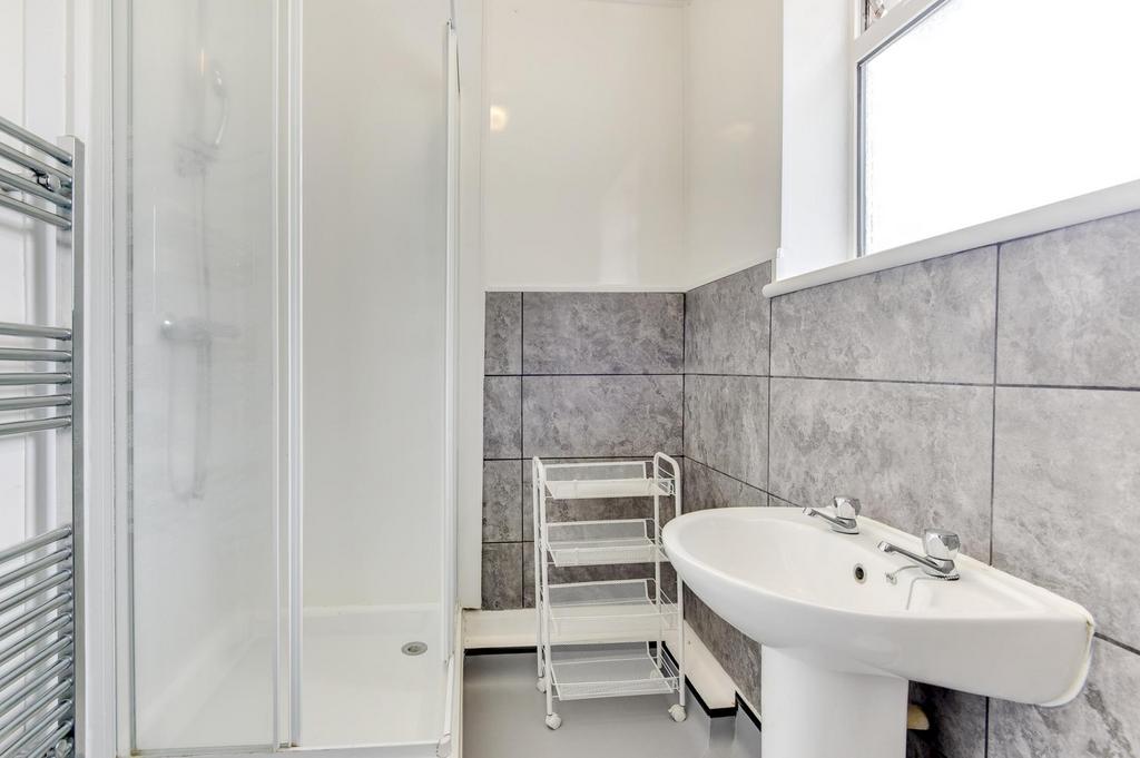 Bright, modern bathroom with a walk-in shower, ...