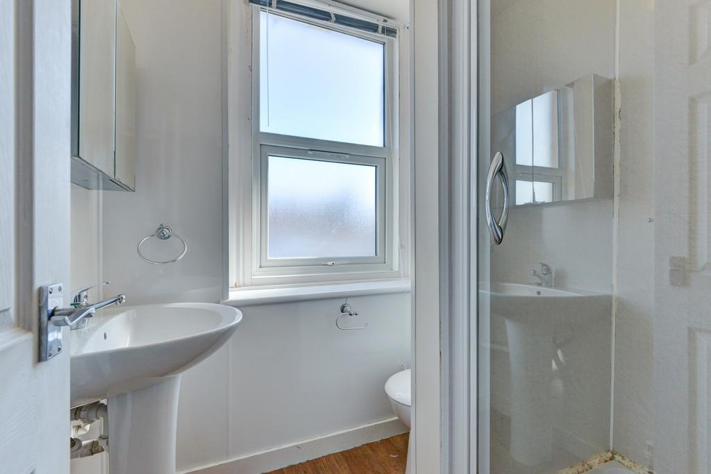 A clean and bright bathroom featuring a large w...
