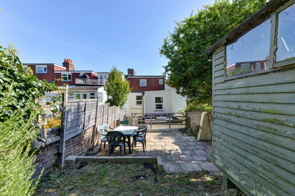 Sunny private rear garden with paved patio, out...