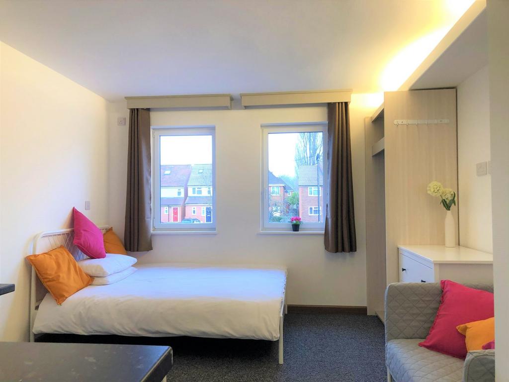 Bright and inviting double bedroom featuring tw...