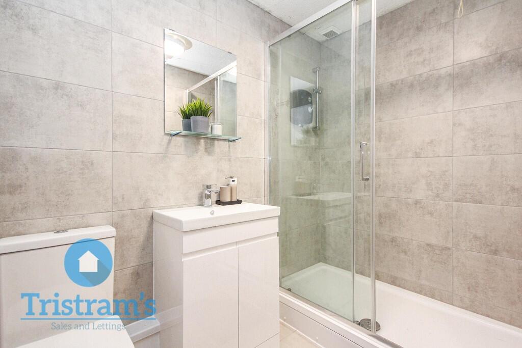 Modern and well-maintained bathroom featuring a...