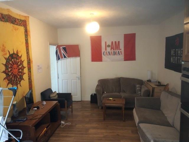 Warm, well-furnished living room with a comfort...