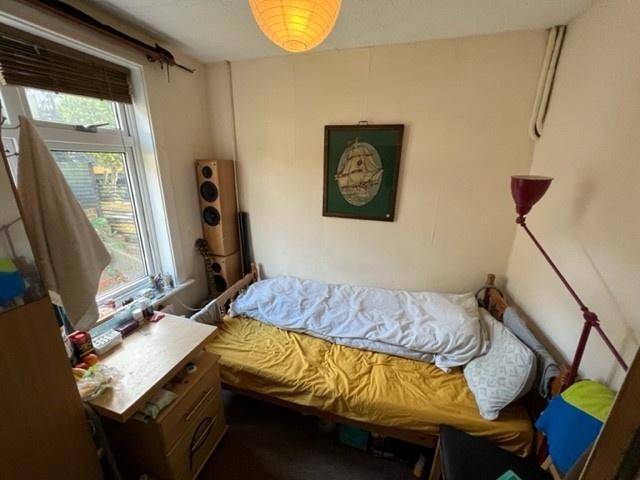 Bright upstairs bedroom with a single bed posit...