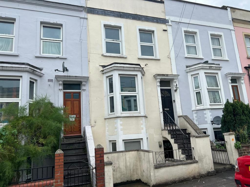 Terraced Victorian-style street with three-stor...