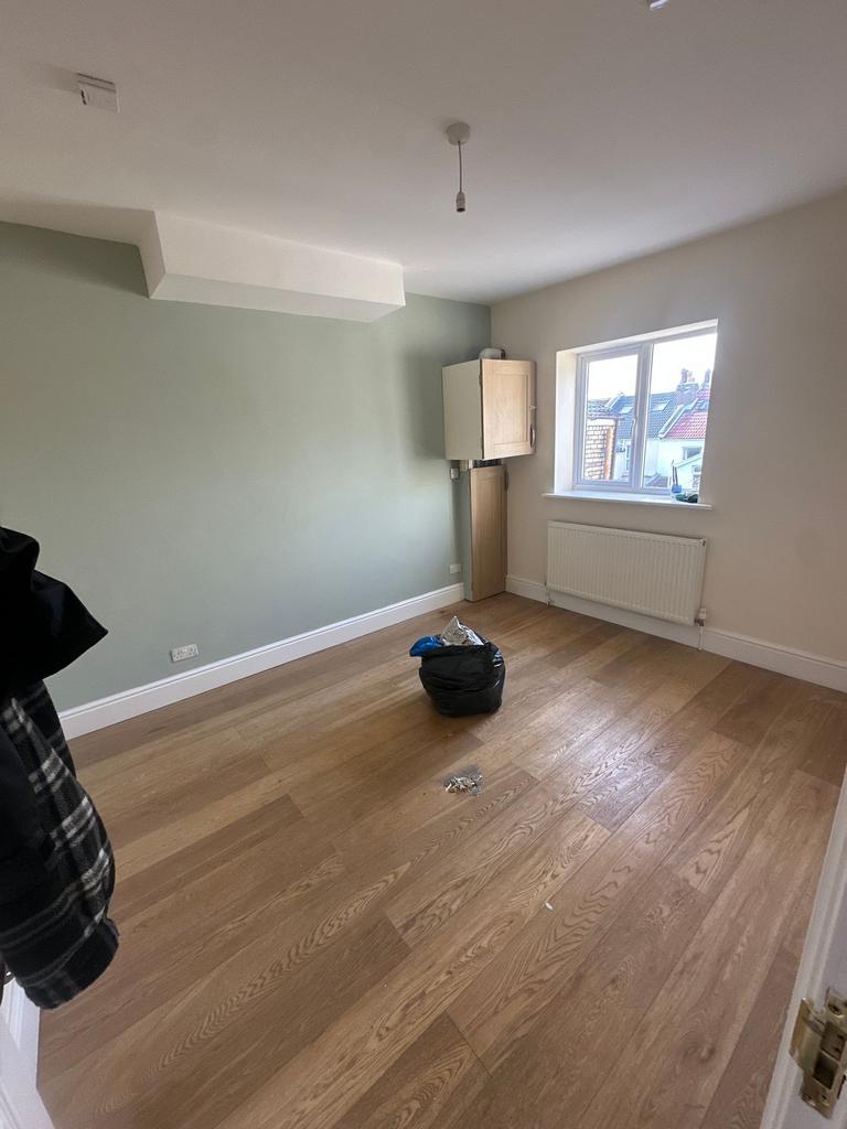 Bright, recently refreshed bedroom with wood fl...