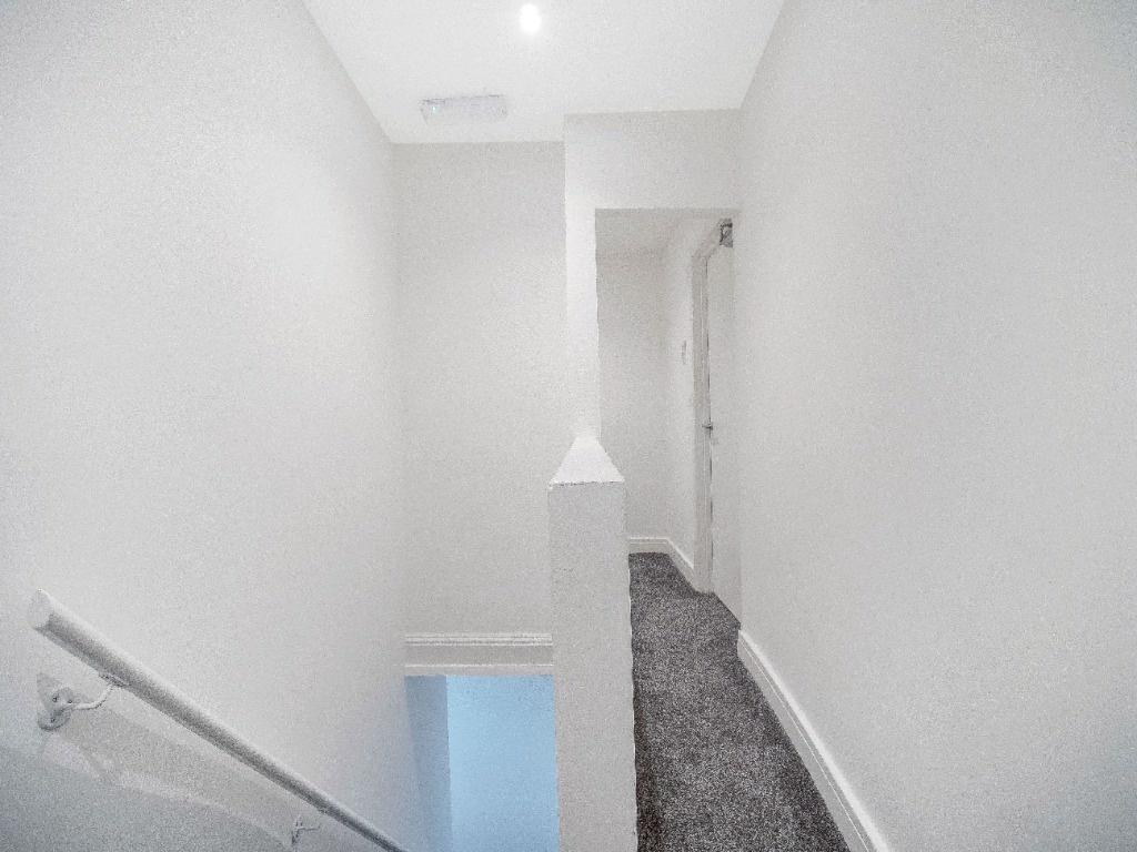 Bright, freshly painted upstairs landing with c...