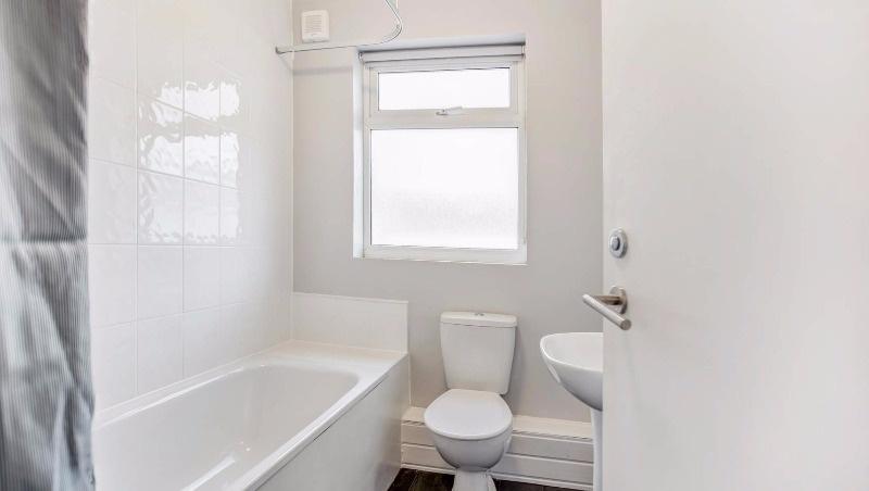 Bright, modern bathroom with a full bath and sh...