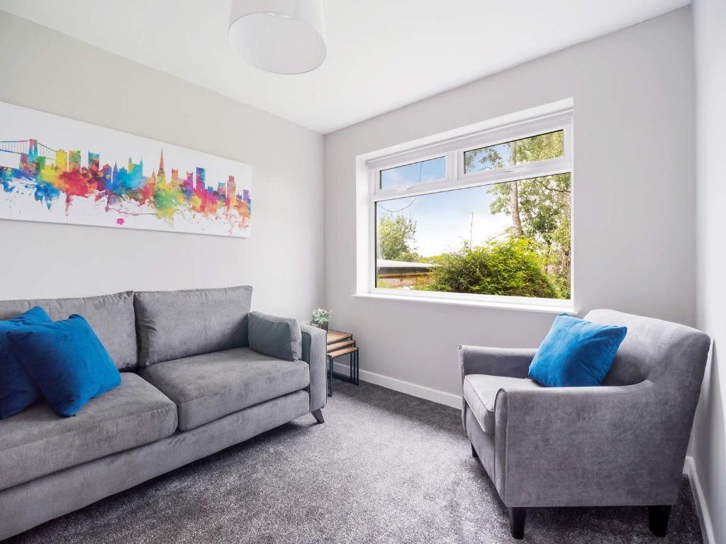 Bright, freshly decorated living room with a la...