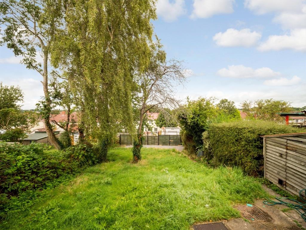 Sunny private rear garden with mature trees, he...