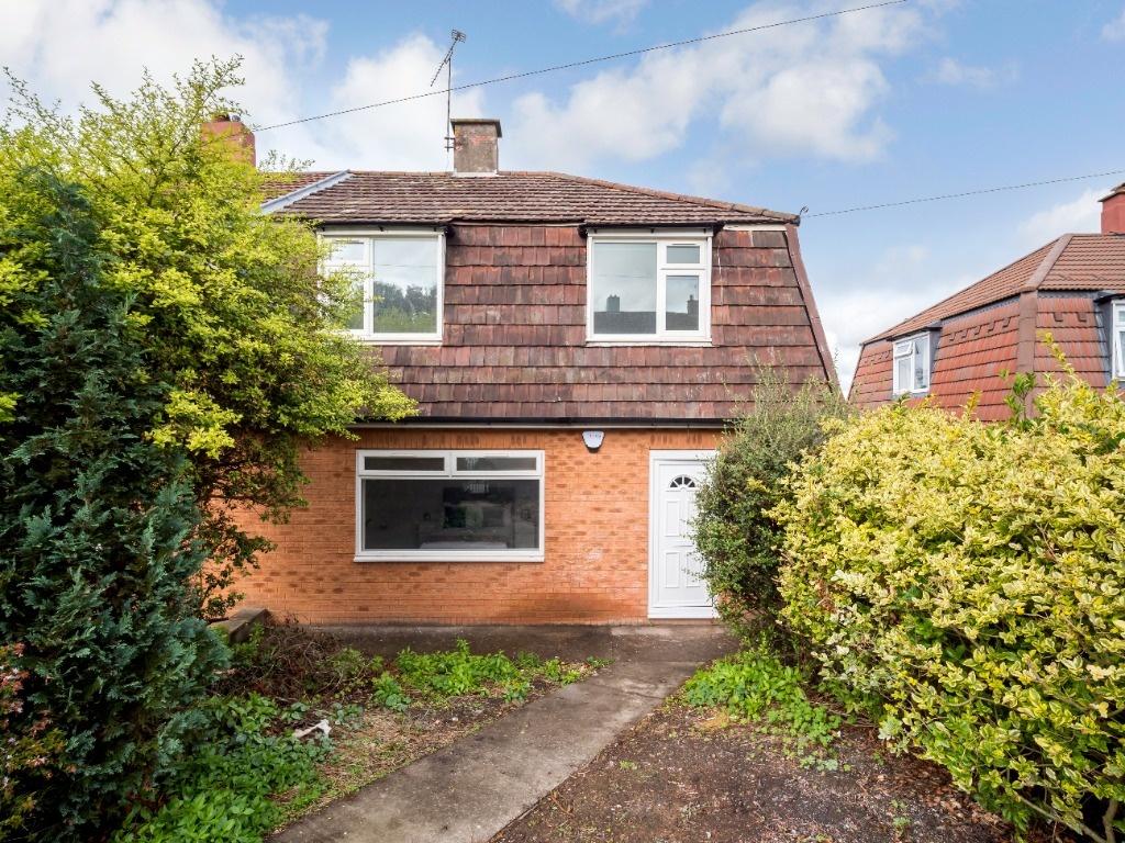 Semi-detached house with a tiled roof, white fr...