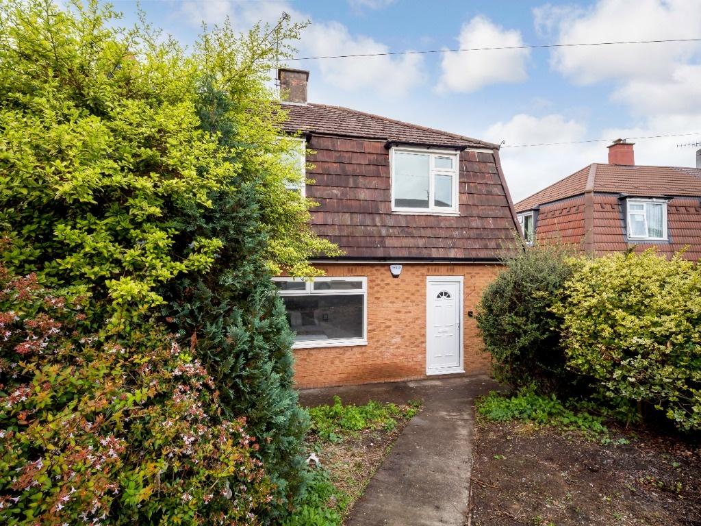 Traditional semi-detached home with a paved pat...