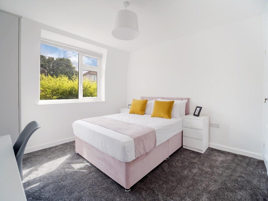 Bright, freshly decorated double bedroom with a...