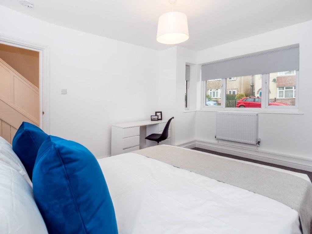 Bright, freshly decorated double bedroom with a...