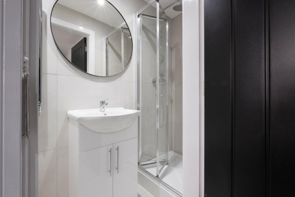 A modern bathroom featuring a compact white van...