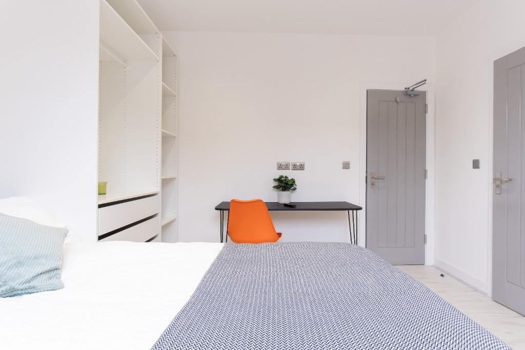 Bright and modern bedroom featuring a spacious ...