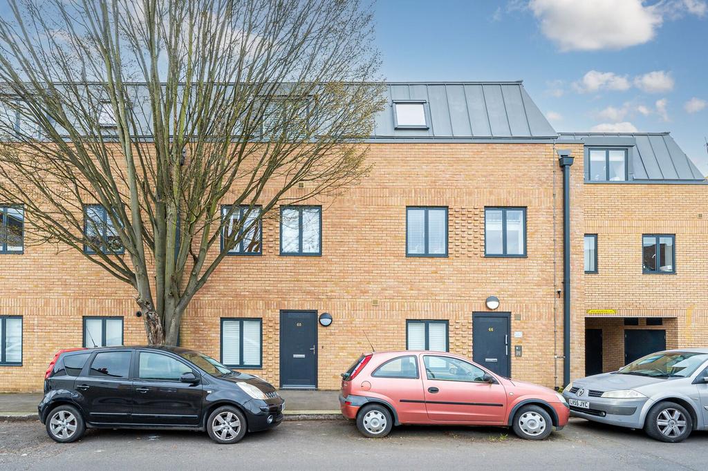 Street scene with property, parking